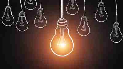 Illustration of light bulbs symbolizing big ideas in career of ADHD adult