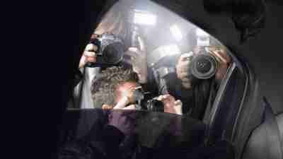 Paparazzi photographing a famous person with ADHD through limo window