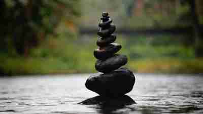 Stacked rocks signifying the time management strategy of doing big tasks first