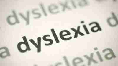 The word "dyslexia" printed on paper macro