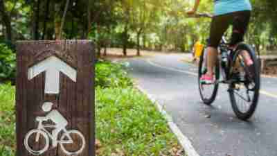 Woman with ADHD getting exercise outside by biking