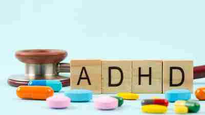 Attention deficit hyperactivity disorder or ADHD with stethoscope and medication.