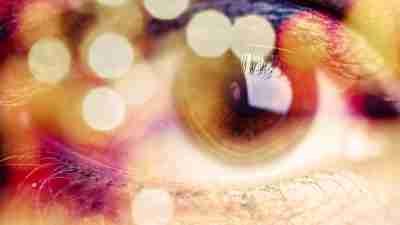 Close up of an eye taking in sensory stimuli