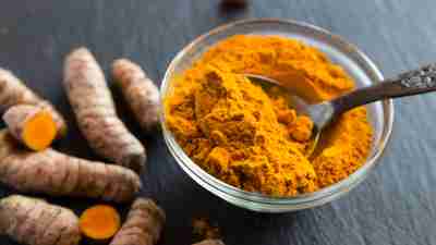 Turmeric and curcumin. Poweder and root. Westend61/Getty Images