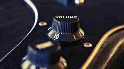 Closeup of a volume knob on a guitar. Sound, sensory sensitivity, noise, music, volume concept