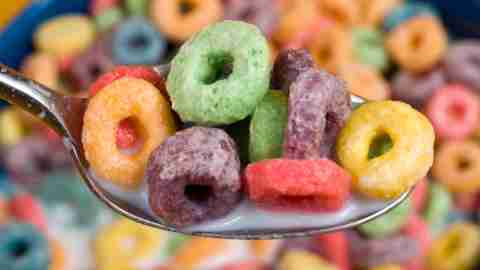 Spoon filled with sugary cereal with bowl in background is a terrible choice for children with ADHD