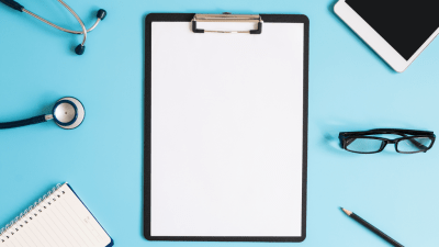 clipboard with paper, stethoscope, pen, glasses--tools to make a sound ADHD diagnosis